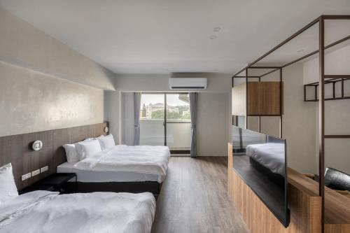 Postel nebo postele na pokoji v ubytování H suite inn