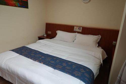 Postel nebo postele na pokoji v ubytování Chenkun Guesthouse