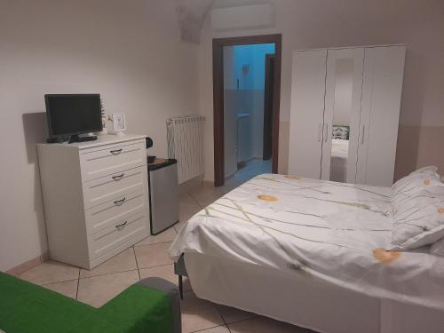 Ένα ή περισσότερα κρεβάτια σε δωμάτιο στο B&B Margherita