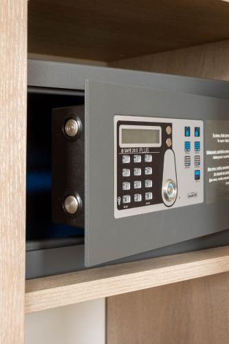 a microwave oven sitting on top of a shelf at City Hotels Rūdninkai in Vilnius
