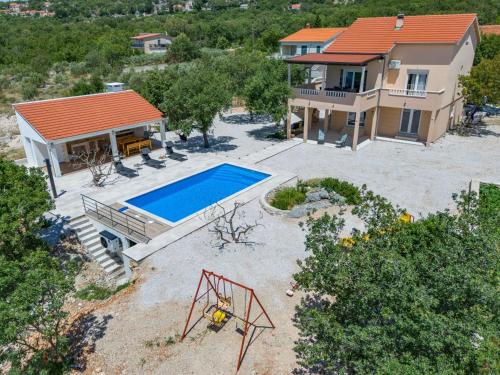 an aerial view of a house with a swimming pool at Perfect holiday in Vila Hany home in Šestanovac