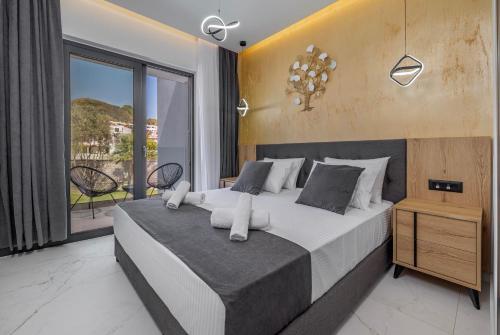 Ένα ή περισσότερα κρεβάτια σε δωμάτιο στο Tota Suites