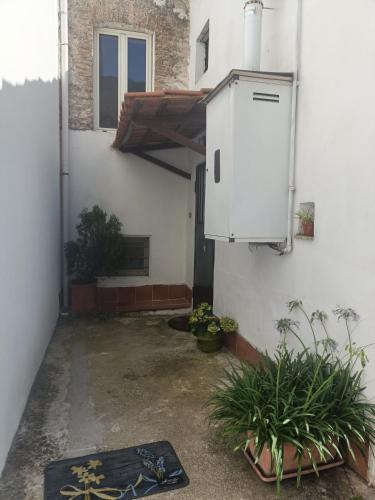 an empty courtyard with a heater on the side of a building at Da Anto in Trivio