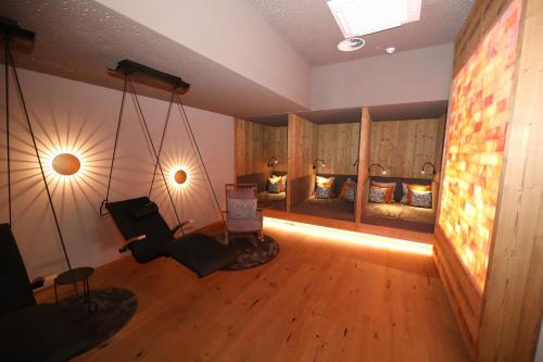 a room with two beds and a room with a swing at Hotel Schachner in Maria Taferl