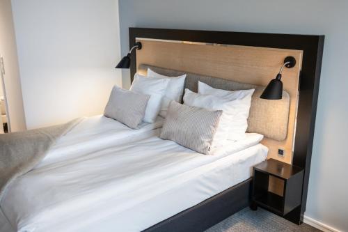 En eller flere senge i et værelse på Gentofte Hotel