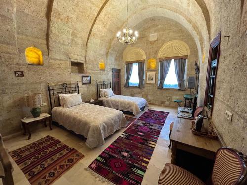 En eller flere senge i et værelse på 1860 KADIEVİ Suites & houses