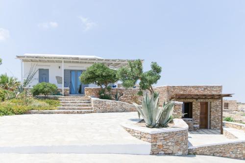 a villa with aiterraneaniterraneaniterranean climate and a stone patio at Windmill Bella Vista in Artemonas