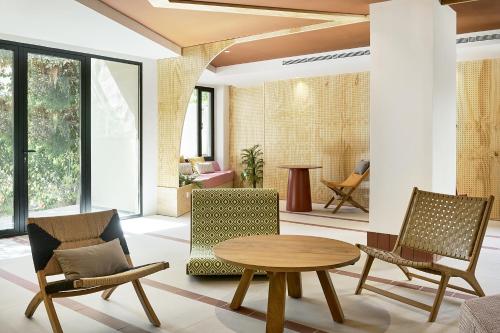 a living room with a table and chairs at tent Bahia de Palma in El Arenal