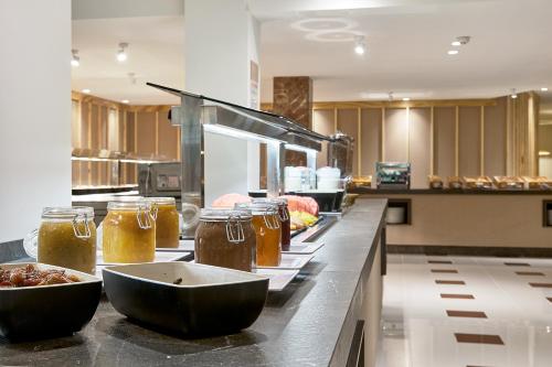 a kitchen with jars of honey on a counter at tent Bahia de Palma in El Arenal