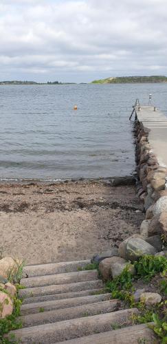 a set of steps leading to a body of water at Ved sjøen, Husvik- Tønsberg, 2 hus! in Tønsberg