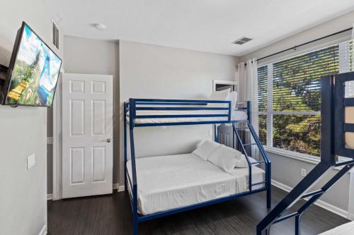 a room with a bunk bed and a window at 4845 Tidecrest Avenue 144 in Orlando