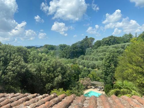 a view from the roof of a house with a swimming pool at Usage exclusif - Palazzo du XVI avec piscine in Crespina