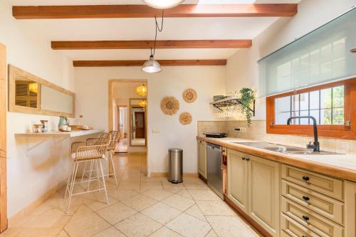 a kitchen with a sink and a counter top at Can Botanic in Sant Josep de sa Talaia