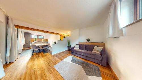 a living room with a couch and a table at Haus Moritz in Oetz