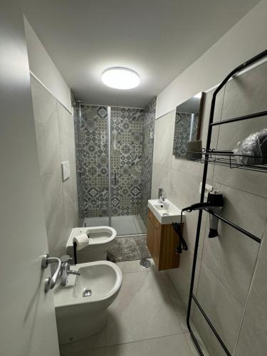 a bathroom with a sink and a toilet and a shower at B&b Sant'Anna in Ercolano