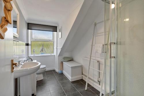 a bathroom with a sink and a toilet and a shower at Finest Retreats - No 11 Porthminster in St Ives