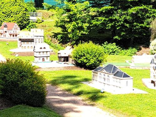 a group of miniature houses in a yard at Appartement les sources in Plombières-les-Bains
