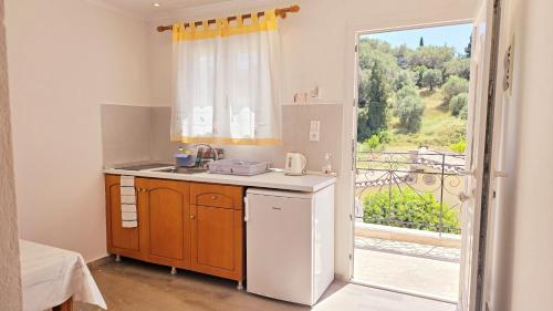 Η κουζίνα ή μικρή κουζίνα στο Villa Kormos Apart Hotel