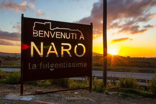 a sign that says benoit a nara on the side of a road at Civico10 in Naro