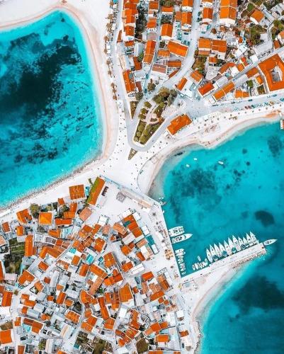 an aerial view of a city next to the water at Villa Marica Primošten in Primošten