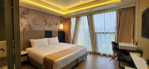 a hotel room with a bed and a window at Dragonfly Hotel - The Art Hotel in Mumbai