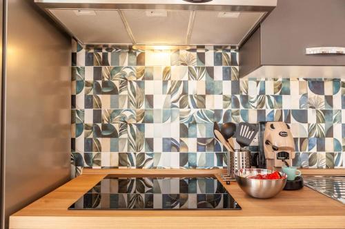 a kitchen with a counter with a sink in it at Appartamento - Cerenea House in Isola del Liri