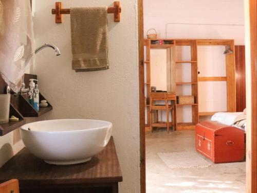 a bathroom with a bowl sink on a counter at Wild Eden Self-Catering Accommodation in Swakopmund