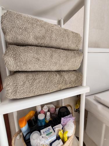 a group of stairs with a basket of products at Paula Pool Apartment Adeje in Adeje