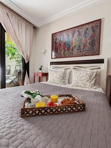 a tray of food on top of a bed at Paula Pool Apartment Adeje in Adeje