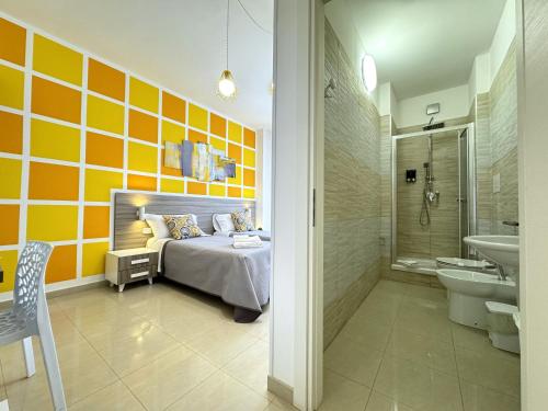 a bedroom with a bed and a shower and a sink at B&B CORSO ROMA Room Suite & Spa in Apricena
