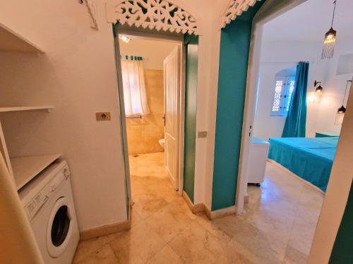 Postel nebo postele na pokoji v ubytování Luxury Nubian Style 1-Bedroom in The Heart of El Gouna