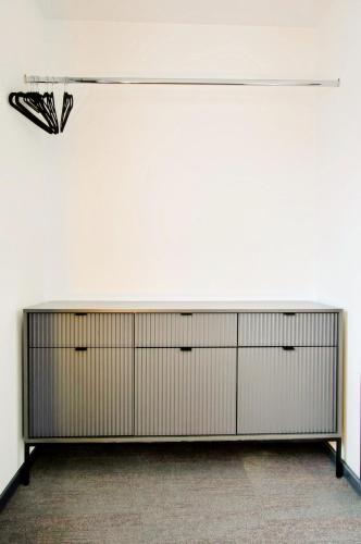 a room with a large closet with a butterfly on the wall at Feel Good in Ravna Gora