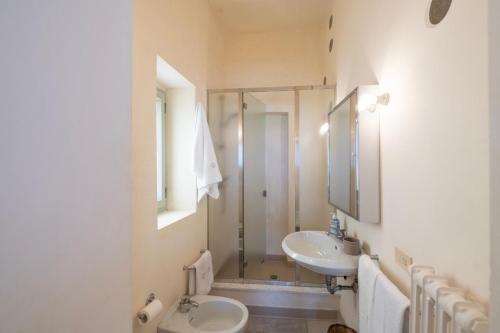 a bathroom with a shower and a toilet and a sink at Riva Mediterranea in Otranto