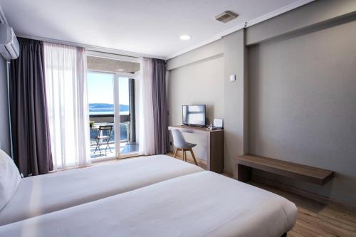 Posteľ alebo postele v izbe v ubytovaní Hotel Alda Sada Marina