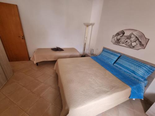 Ένα ή περισσότερα κρεβάτια σε δωμάτιο στο Villa Serroni