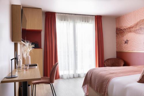 a hotel room with a bed and a desk and a window at Hôtel Best of Both - Divonne-les-Bains in Divonne-les-Bains