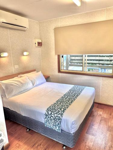 Letto o letti in una camera di Kanasta Caravan Park