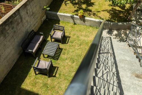 a group of chairs sitting on the grass at APARTMENTS NENSI in Sarajevo