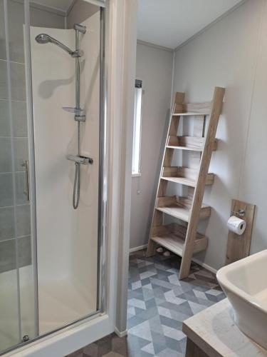 a bathroom with a shower and a sink at Addlethorpe Golf & Country Club, Ingoldmells in Addlethorpe