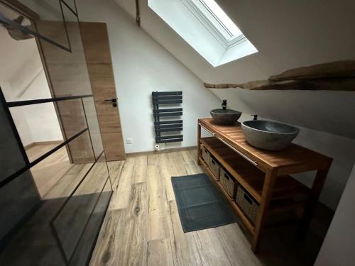 a bathroom with two sinks and a glass shower at Maison de charme, pierres blanches, SPA Jaccuzi in Camblain-lʼAbbé