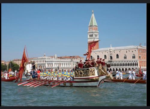 a group of people on a boat in the water at The B Collection - San Marco Riva schiavoni in Venice