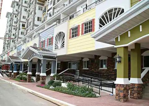 a row of buildings on the side of a street at Apple One Banawa Heights Cebu City Cheap & High Quality in Cebu City