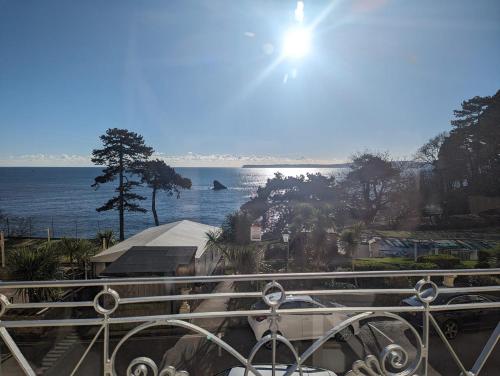 a view of the ocean from a balcony at The Osborne Apartments in Torquay