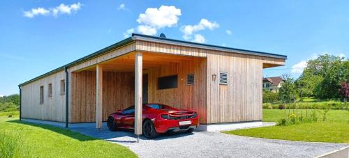 a car parked in the front of a building at Ferienhaus DAS GLAB in Velden am Wörthersee