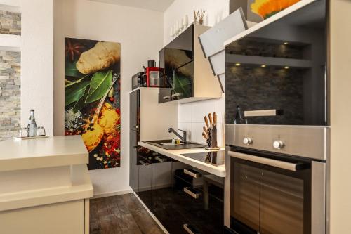 a kitchen with a sink and a counter at Hotel Ochsen in Bad Saulgau