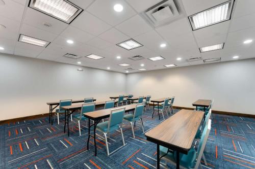a classroom with tables and chairs in a room at Hampton Inn Milford in Milford