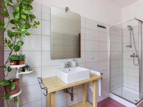 a bathroom with a sink and a shower at Your Room in Catania in Catania