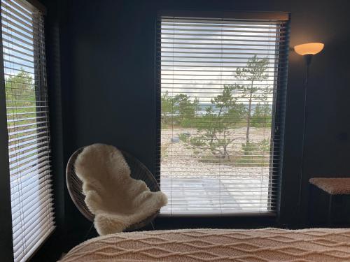 a bedroom with a bed and a window with a view at Seaside Rendezvous 2 in Kalana