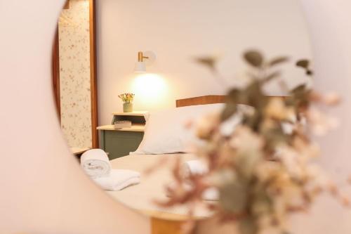 a bedroom with a bed and a mirror at Casa Biondina, Corfu Town in Corfu Town