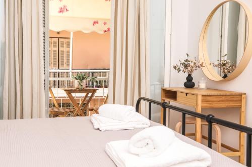 a bedroom with a bed and a mirror at Casa Biondina, Corfu Town in Corfu Town